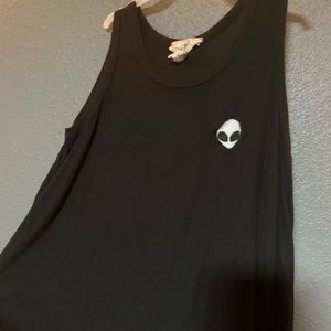 black tank top with small alien logo